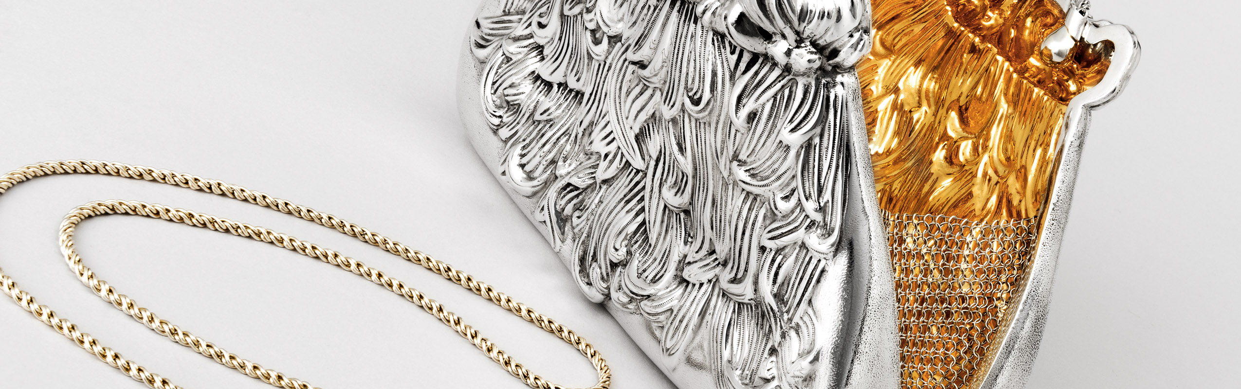 Photo of a sterling silver and 24K gold evening purse  by Michael Galmer.