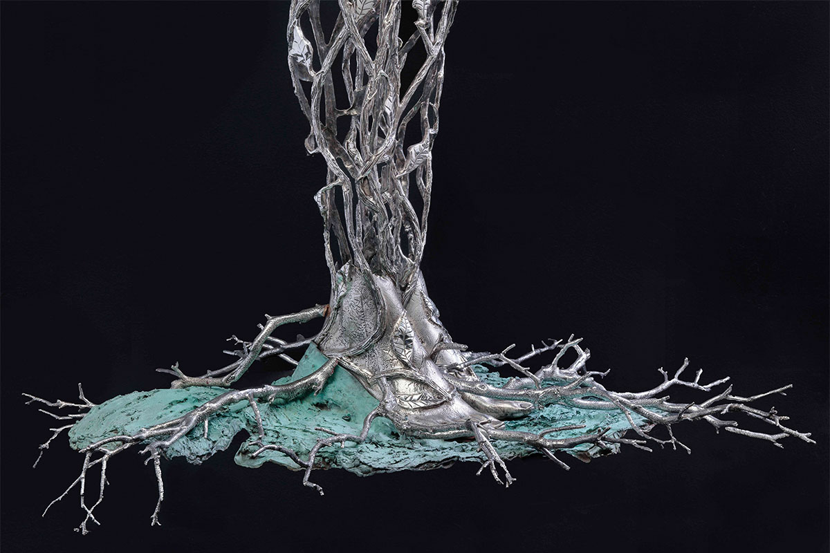 Detail of the silver feet and branches on Michael Galmer's sculpture 'Chrysanthemum Woman'.