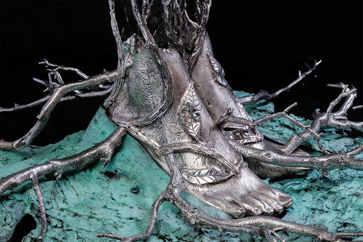Detail of the silver feet and branches on Michael Galmer's sculpture 'Chrysanthemum Woman'.