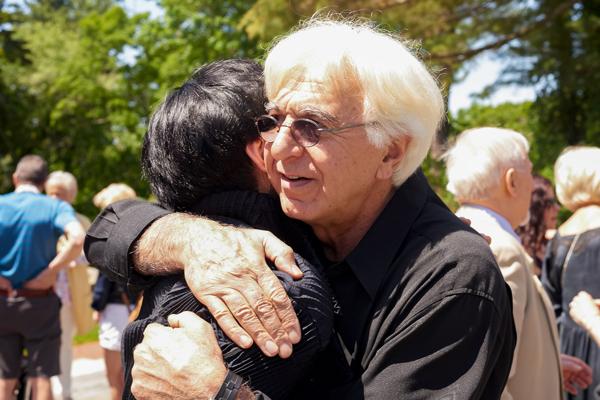 Photo of silver sculpture artist Michael Galmer at the 'Tears of the Holocaust' opening reception at Holocaust Museum.