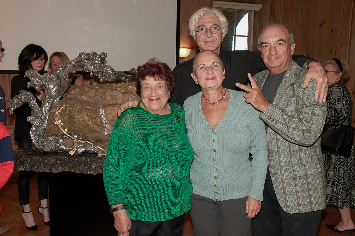 Photo of silver sculpture artist Michael Galmer at the 'Tears of the Holocaust' opening reception at Holocaust Museum.