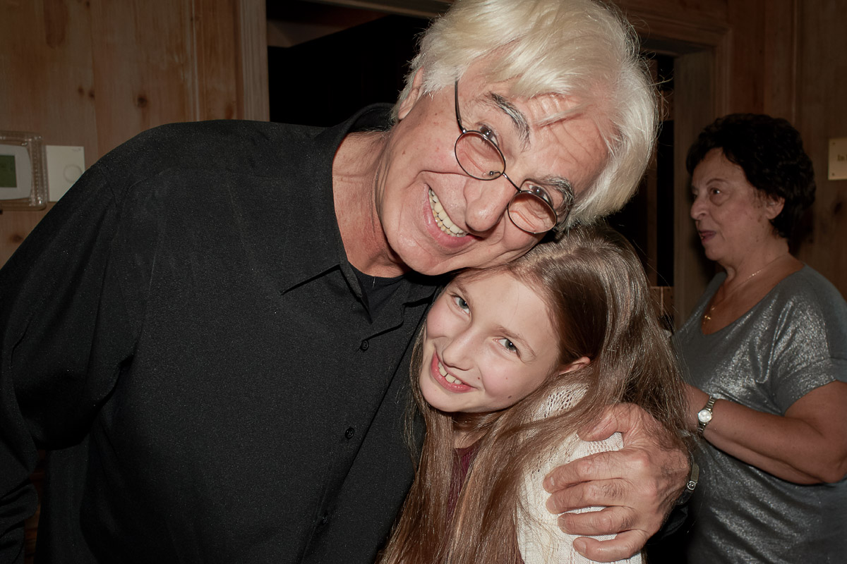 Photo of silver sculpture artist Michael Galmer at the 'Tears of the Holocaust' opening reception at Holocaust Museum.